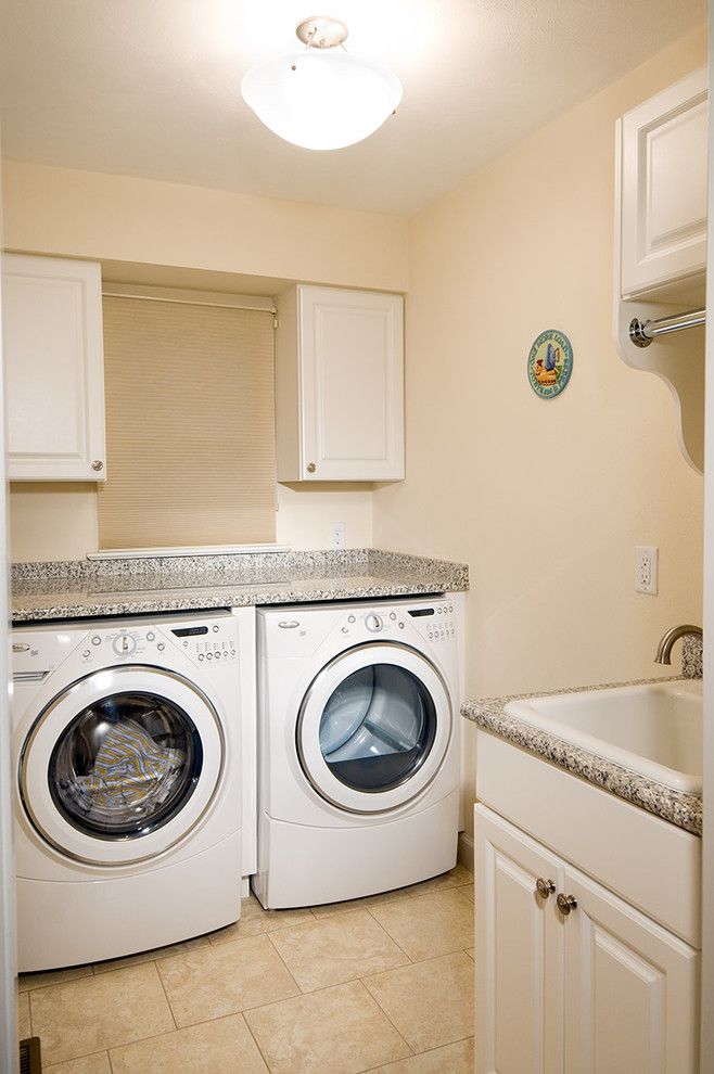 Gas Dryer vs Electric Dryer for a Traditional Laundry Room with a Utility Sink and Laundry Room by Benson Homes Llc