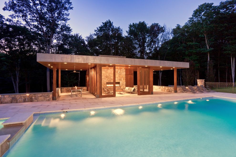 Glass House New Canaan for a Modern Pool with a Fence and Modern Pool House by Jablonski Associates