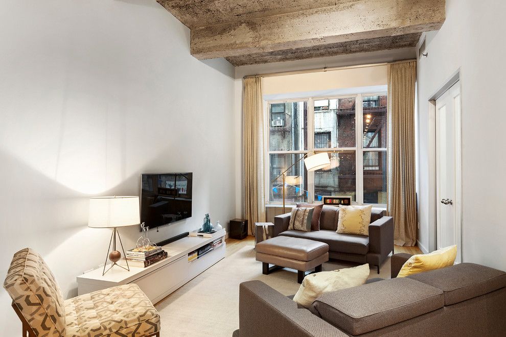 Gotham Lighting for a Industrial Living Room with a Hardwood Floors and 419 West 55 Street | $1.15m by the Noble Black Team at Douglas Elliman