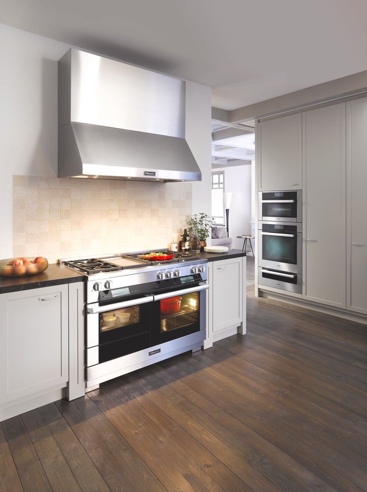 Great Dane Harlequin for a Contemporary Kitchen with a Dark Wood Flooring and Miele by Miele Appliance Inc