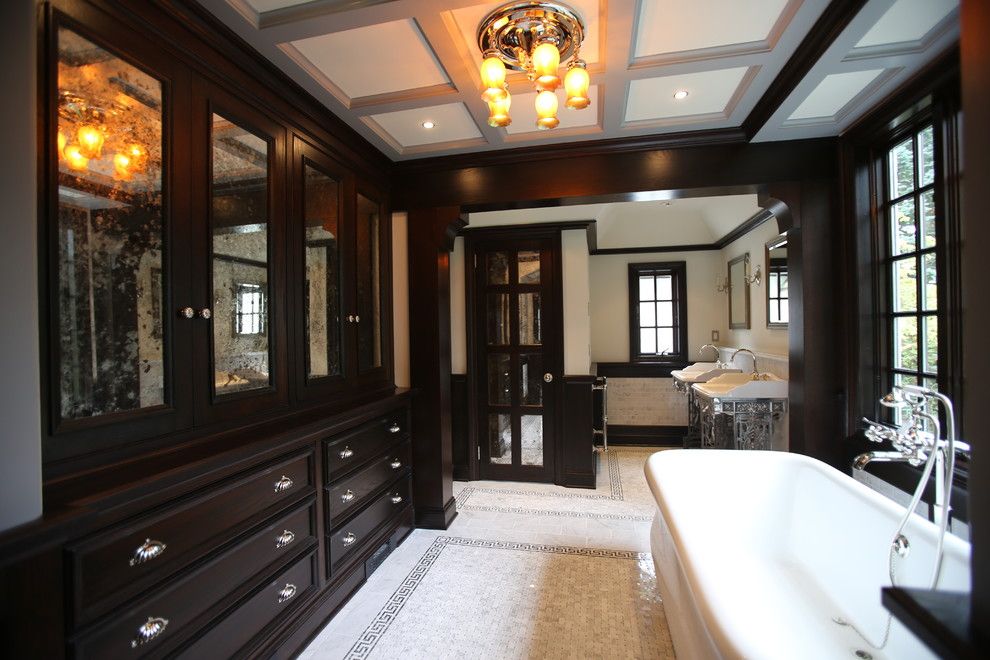 Greek Revival Homes for a Traditional Bathroom with a Dark Wood Pillar and Henry Viii Inspired Bathroom by Mfm Design & Construction Llc