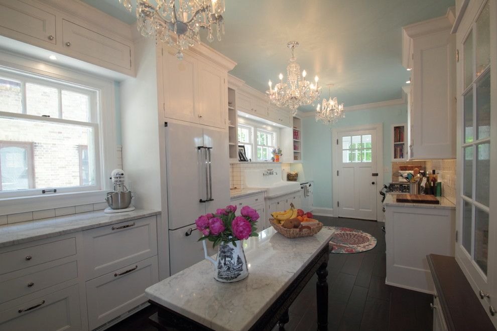 Grote Lighting for a Farmhouse Spaces with a White Cabinets and Tudor Kitchen by Cream City Construction