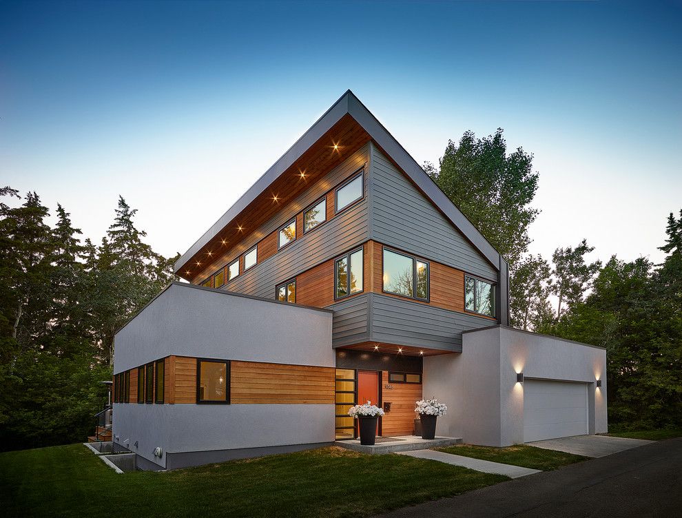 Hardie Trim for a Contemporary Exterior with a Stucco Siding and Millcreek House by Effect Home Builders Ltd.