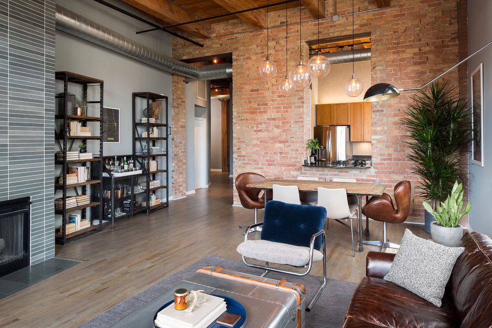 Havenly for a Industrial Living Room with a Gray Floors and River North Loft by Haven Design Studio