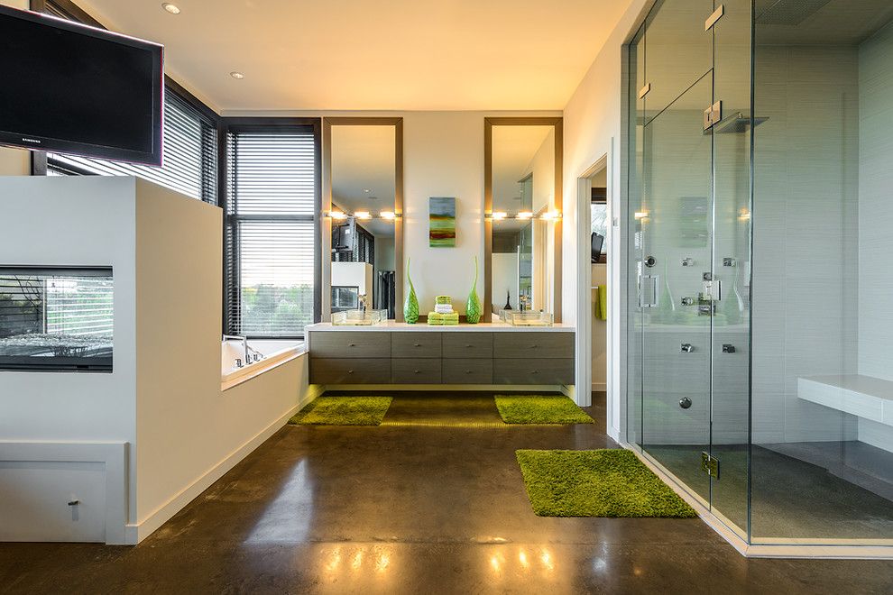 H&c Concrete Stain for a Contemporary Bathroom with a Framed Mirrors and Dwell on Despard by Joshua Lawrence Studios Inc