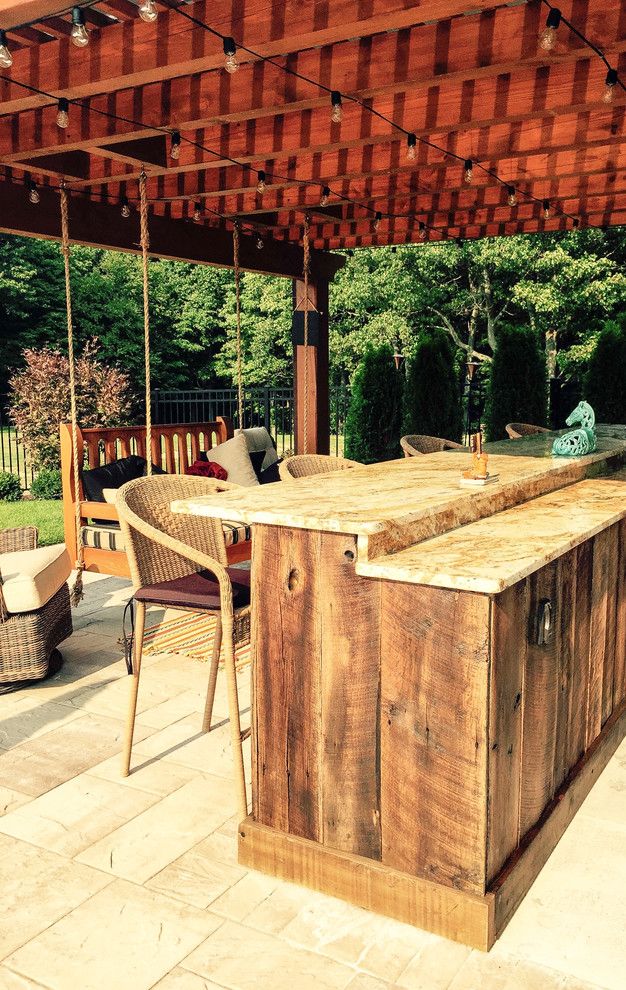 Hearth and Grill for a Rustic Pool with a Landscaping Troy and Pool Project Clifton Park, Ny by Pearl Landscaping & Patio Company