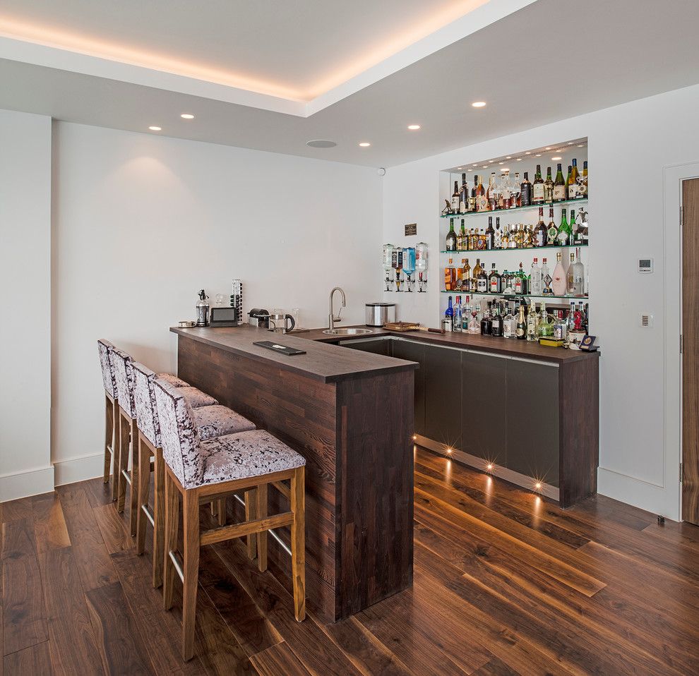 Homesmart Realty for a Contemporary Home Bar with a Home Bar Designs and in the Corner of the Games/family Room, a Home Bar. by London Basement