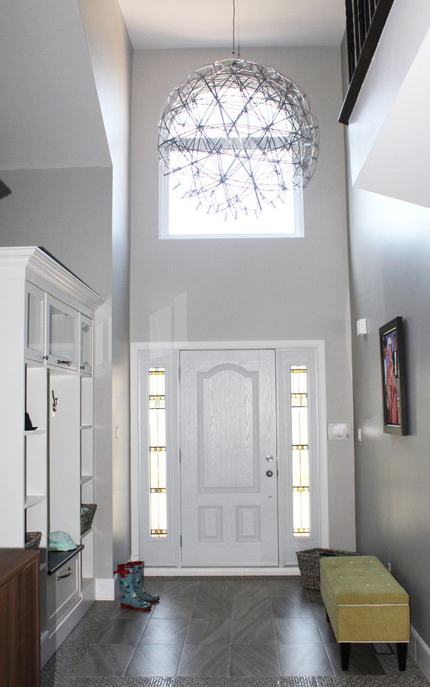 Hooked on Ornaments for a Contemporary Entry with a Family Room and a Young Family's Happy , Safe, Home by Toc Design