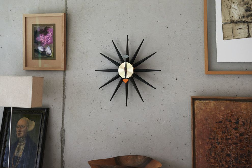 Hooked on Ornaments for a Contemporary Hall with a Vitra Eames Lounge Chair and Vitra Sunburst Wall Clock by Nest.co.uk