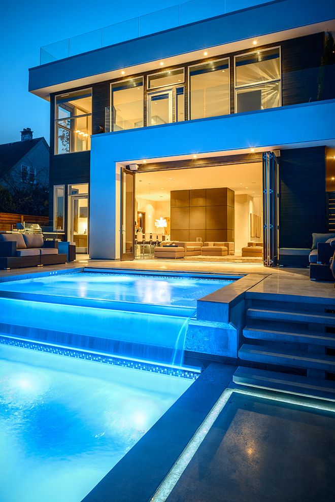 Hot Tubbing for a Contemporary Pool with a Folding Doors and Dwell on Despard by Joshua Lawrence Studios Inc