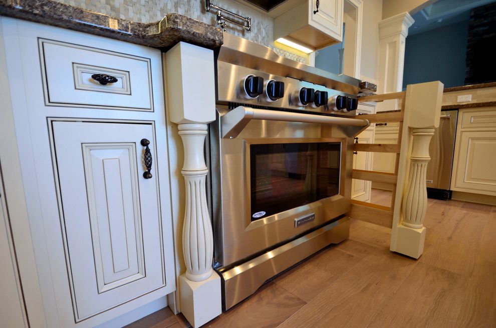 House Umber for a Transitional Kitchen with a Cambria and Pullout Spice Rack Legs by Wolff Kitchen & Bath