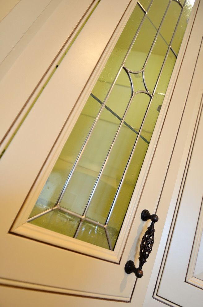 House Umber for a Transitional Kitchen with a Delta and Leaded Glass Door by Wolff Kitchen & Bath