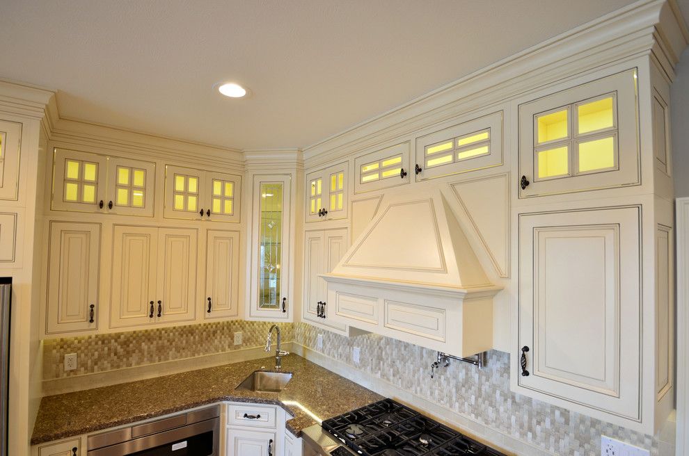 House Umber for a Transitional Kitchen with a Rough Edge and Custom Range Hood by Wolff Kitchen & Bath