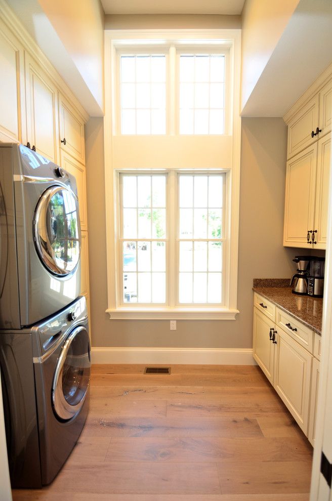 House Umber for a Transitional Laundry Room with a Kitchen Islands Carts and Laundry with a Veiw by Wolff Kitchen & Bath