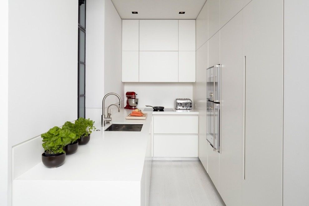 How Do Tankless Water Heaters Work for a Modern Kitchen with a White Walls and Mayfair Apartment by Tla Studio