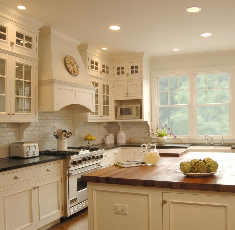 How to Fix Holes in Drywall for a Traditional Kitchen with a Tile Backsplash and White Kitchen by the Kitchen Studio of Glen Ellyn