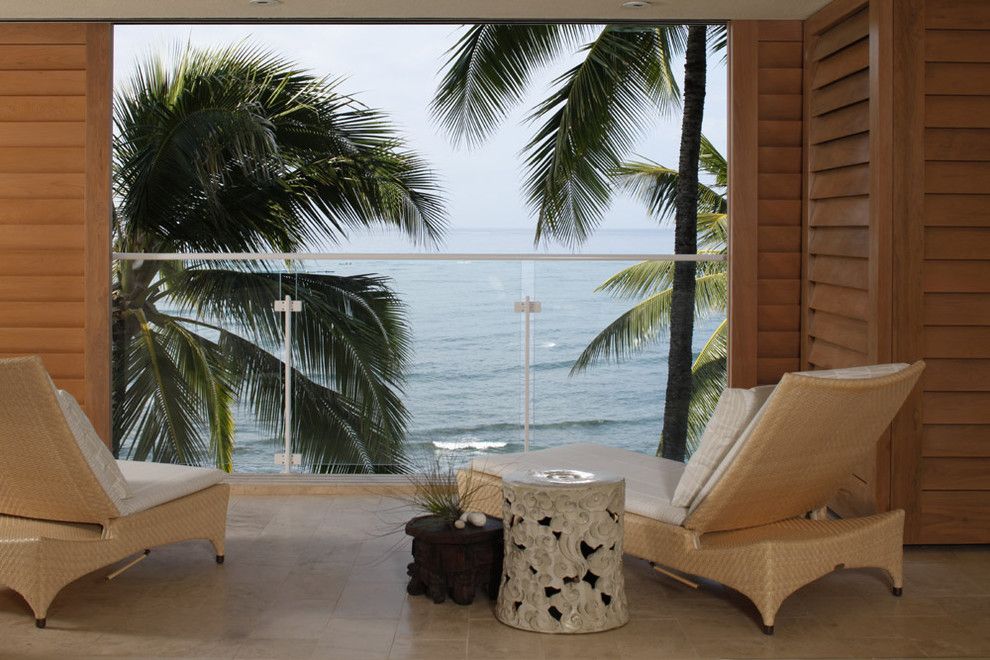 How to Get Rid of Cat Spray Smell for a Tropical Deck with a Lanai and Waterfront Grace by Philpotts Interiors