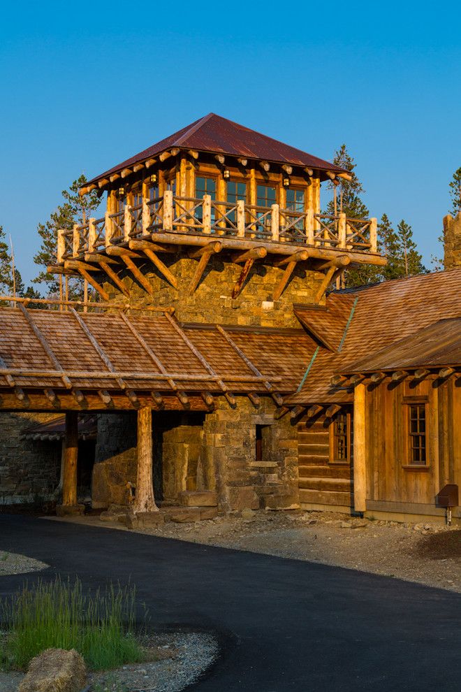 How to Get Skunk Smell Out of House for a Rustic Exterior with a Stone Wall and Foxtail Residence by Teton Heritage Builders