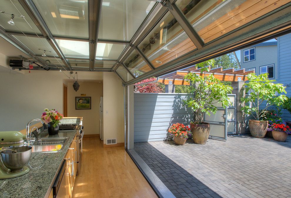 How to Install Prehung Door for a Beach Style Kitchen with a Paved Patio and Courtyard Kitchen with Door Up. by Dan Nelson, Designs Northwest Architects