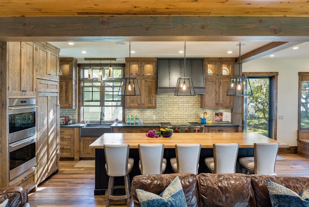 How to Restain Wood for a Rustic Kitchen with a Rustic and Central Minnesota Lake Home by Charlie & Co. Design, Ltd