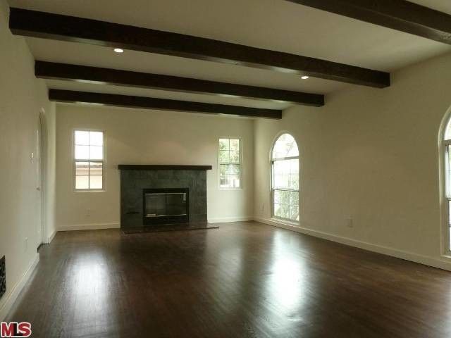 How to Sand Drywall for a Mediterranean Living Room with a Dark Wood Exposed Beams and Burnside by Gabriel Crouch Re