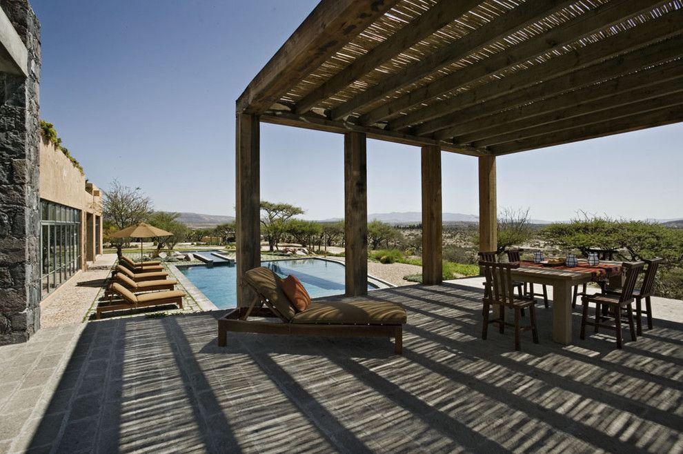 Howell Furniture for a Mediterranean Patio with a Rustic and Mexico House by David Howell Design