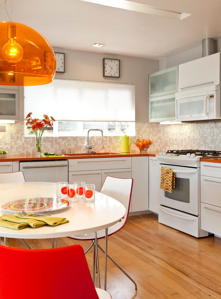 Ikea Dishwasher for a Midcentury Kitchen with a Oceanside Glass Tile and Colorful Mid Century Modern Residence by Kropat Interior Design