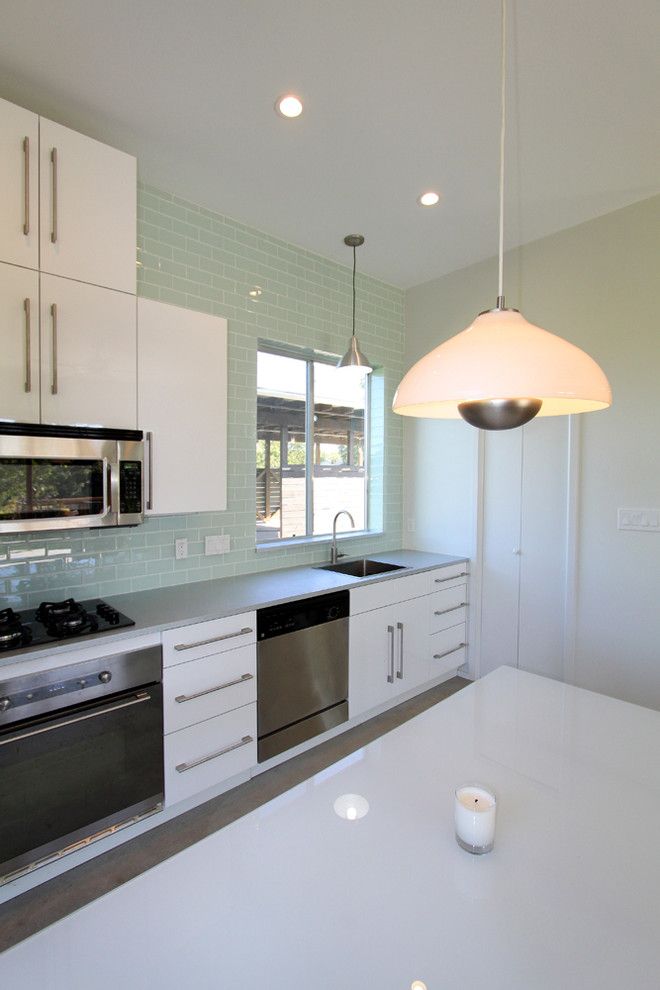 Ikea Dishwasher for a Modern Kitchen with a Green Glass Tile and Pivot Pad, Ignacio Salas Humara Architect by Ignacio Salas Humara Architect Llc