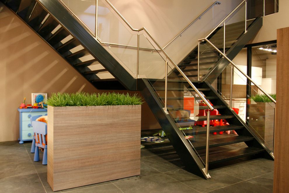 Ikea Planters for a Contemporary Staircase with a Wood Planter and Straight Stairs with Stone Treads and Glass Railing by Eestairs America Inc