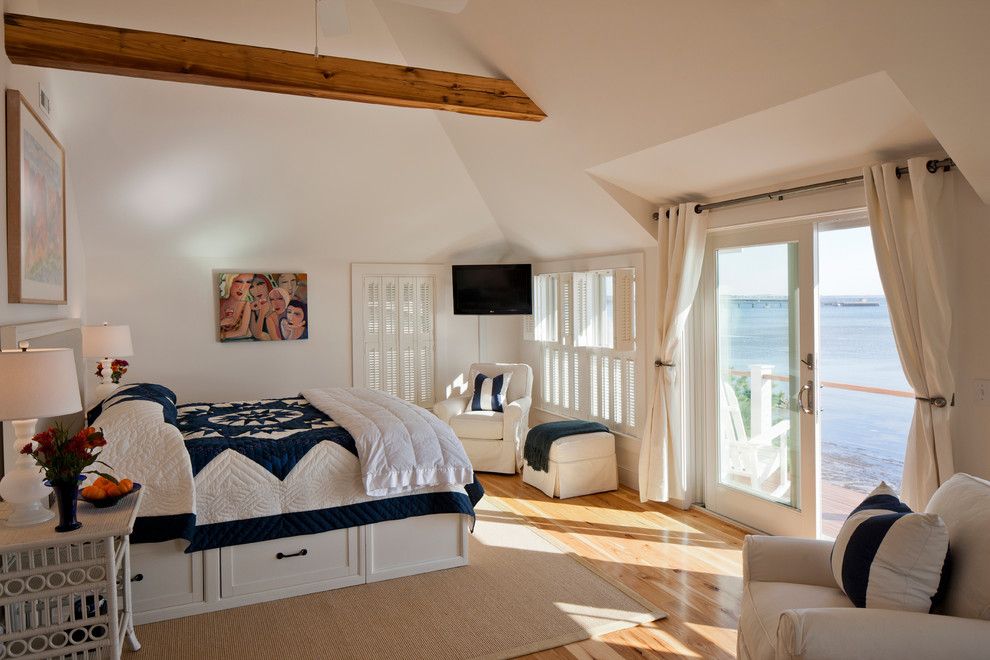 Ikea Slatted Bed Base for a Beach Style Bedroom with a White Arm Chair and Provincetown Beach House by Peter Mcdonald Architect