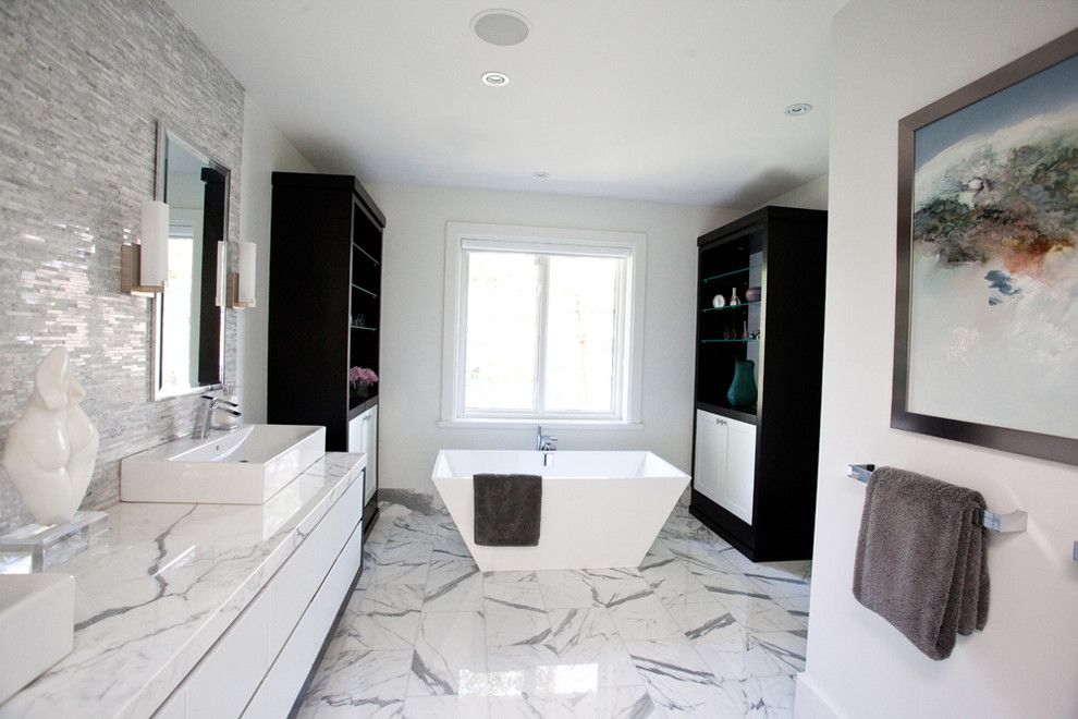 Installing a Bathtub for a Modern Bathroom with a Ceiling Lighting and Storm Residence by Jodie Rosen Design