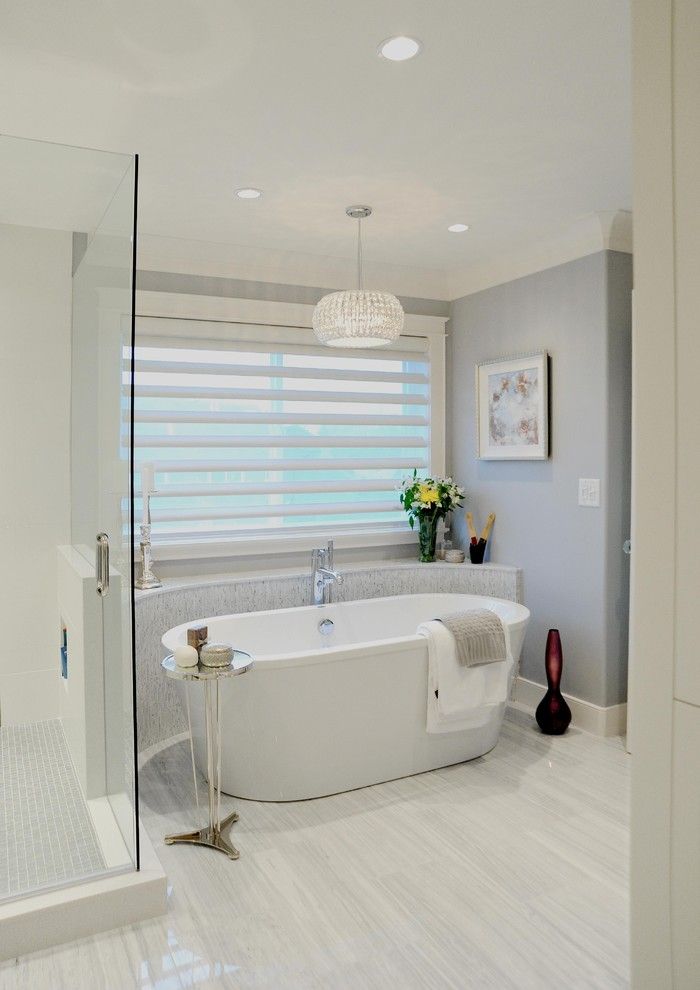 Installing a Bathtub for a Traditional Bathroom with a Blinds and White Rock by Enviable Designs Inc.