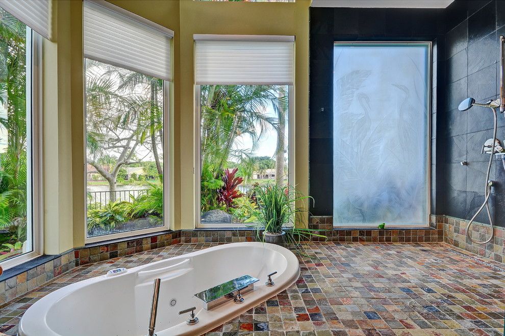 Installing a Bathtub for a Tropical Bathroom with a Palm Trees and Modern Warmth – Boca Raton, Florida by Interiors by Shelly Preziosi