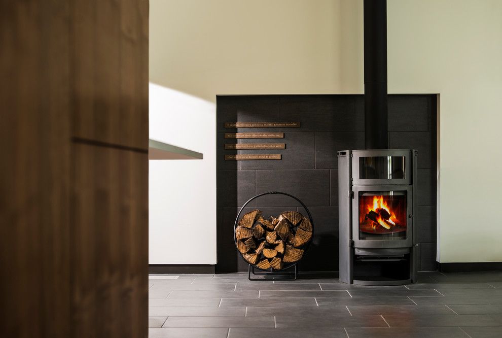 Installing a Wood Stove for a Contemporary Living Room with a Fire and Stacey Turley Residence by Kariouk Associates