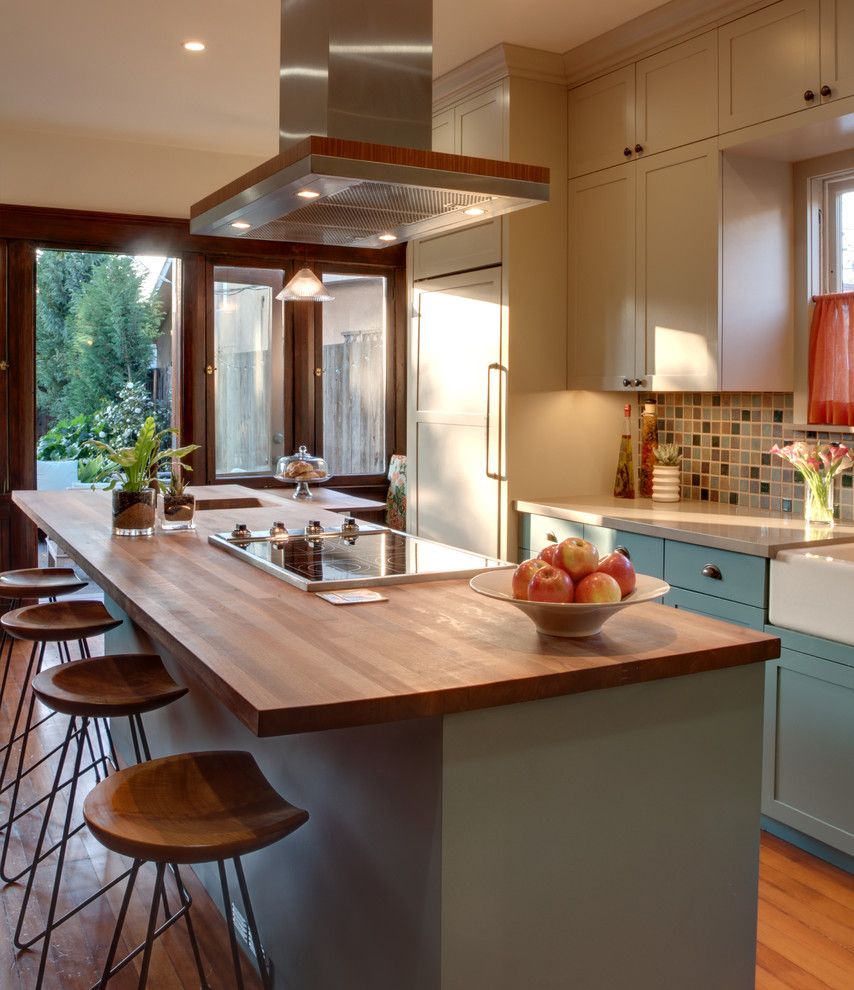 Installing a Wood Stove for a Traditional Kitchen with a Bronze Hardware and Craftsman Kitchen by Synthesis Inc.