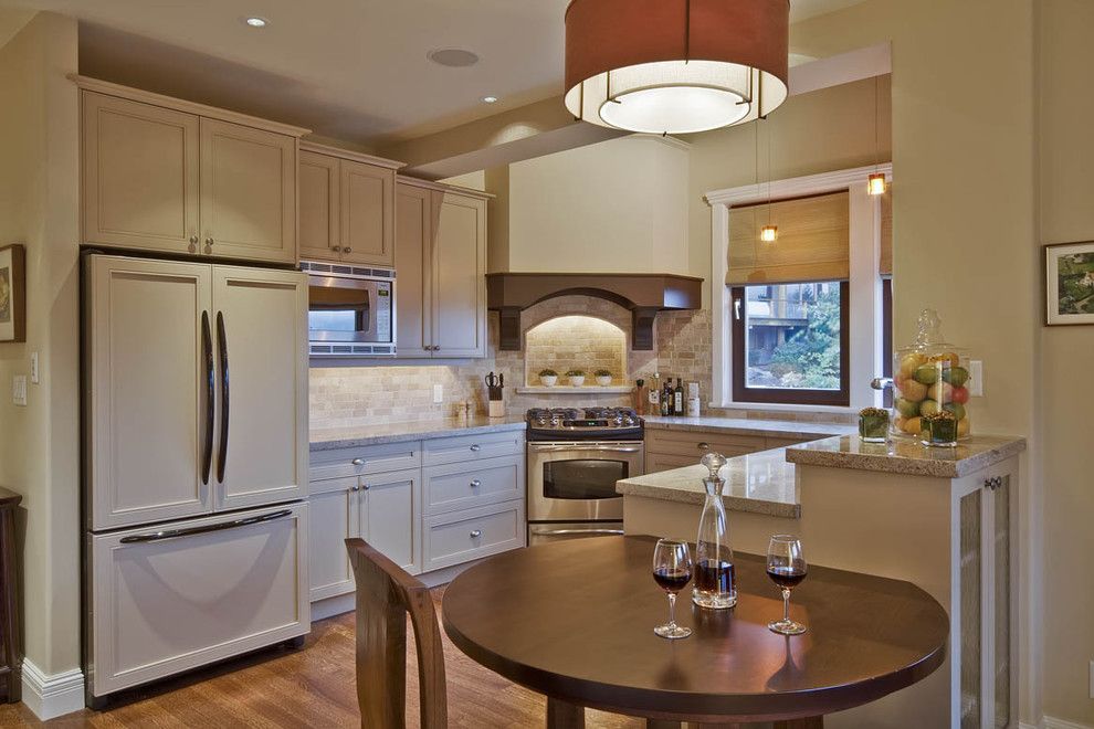 Installing a Wood Stove for a Traditional Kitchen with a White Kitchen and Whistler by Debbie Evans Interior Design