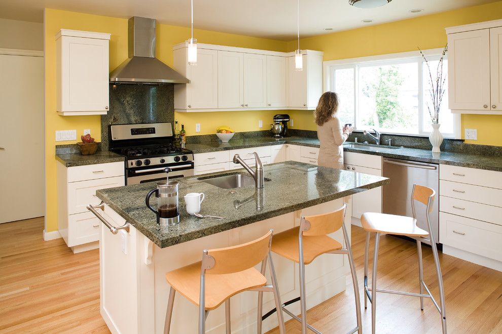 Installing Laminate Countertops for a Contemporary Kitchen with a Open Floor Plan and Modern Arts & Crafts Kitchen with Painted Shaker Style Cabinets by Mn Builders