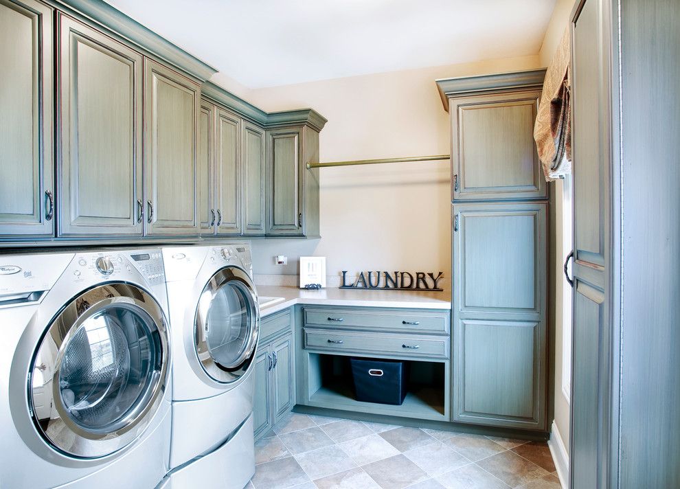 Johns Appliance for a Traditional Laundry Room with a Beige Countertop and Custom Residence in the Reserve of St. Charles by John Hall Custom Homes