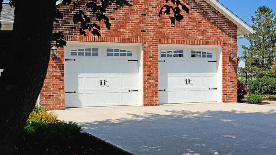 Kb Homes Reviews for a Traditional Garage with a Exterior and Stamped Carriage House by Empire Overhead Doors, Llc