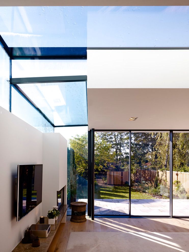 Kensho for a Contemporary Spaces with a Matt Lacquer Grey Kitchen and Roundhouse Linking Indoors to Outside by Roundhouse