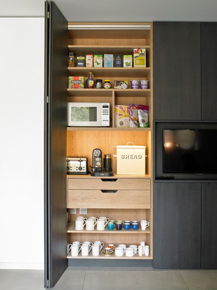 Kettle Moraine Appliance for a Contemporary Kitchen with a Bespoke and Breakfast Cabinet with Bi Fold Doors by Brayer Design