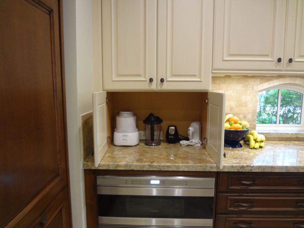 Kettle Moraine Appliance for a Traditional Kitchen with a Butcher Block Island Top and Kitchen by Maggie Grants by Cabinets & Designs