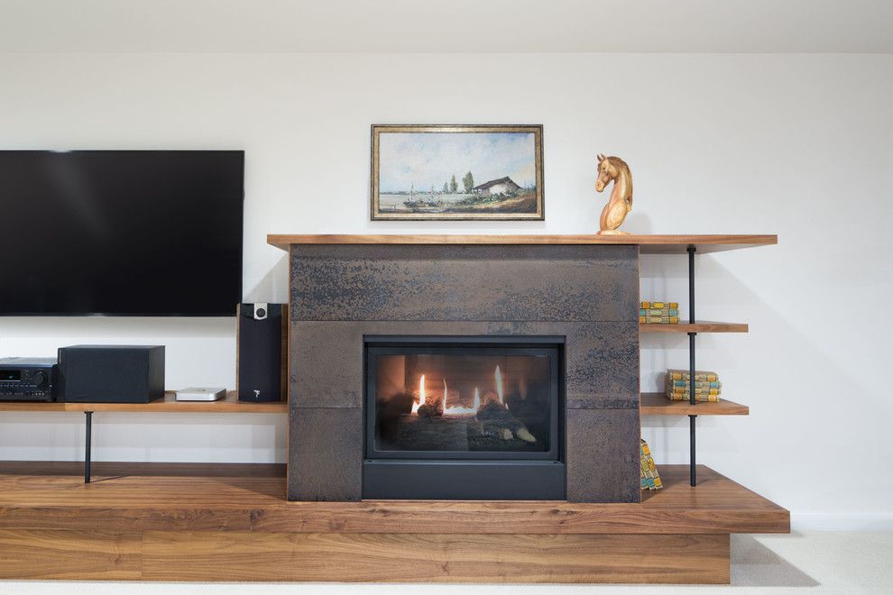 Kingsman Fireplace for a Modern Living Room with a Smith and Valle Woodworks and Modern Remodel by Chuckanut Builders