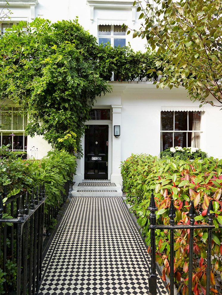 Koehler Home Decor for a Traditional Entry with a Black Front Door and Holland Park House Renovation by Tylermandic Ltd