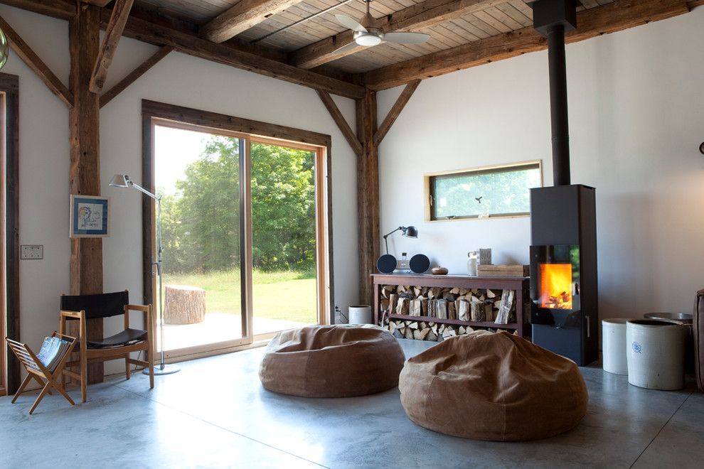 Koit for a Rustic Living Room with a Sliding Glass Doors and Bovina House by Kimberly Peck Architect