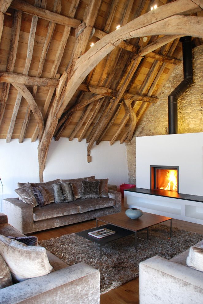 Koorsen Fire and Security for a Rustic Living Room with a Cornwall and Grade Ii* Listed Medieval Barn Conversion, Bude, Cornwall, Uk by the Bazeley Partnership