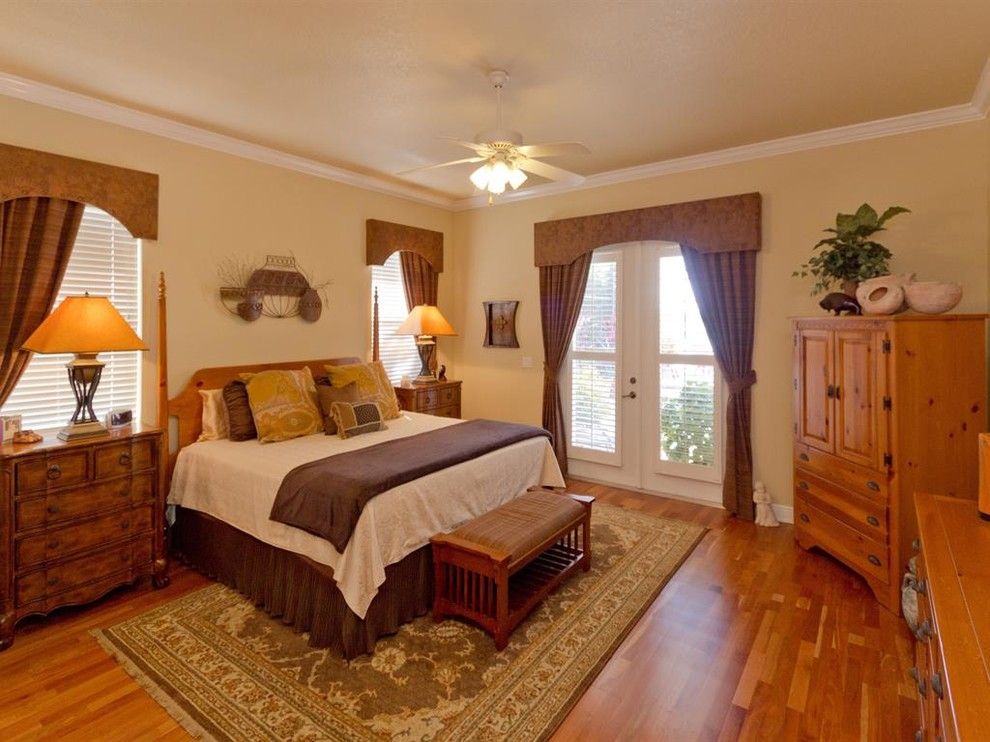 Lanai Definition for a Traditional Bedroom with a Yellow Exterior and Custom Lakefront   Johns Cove Lane by J&j Building