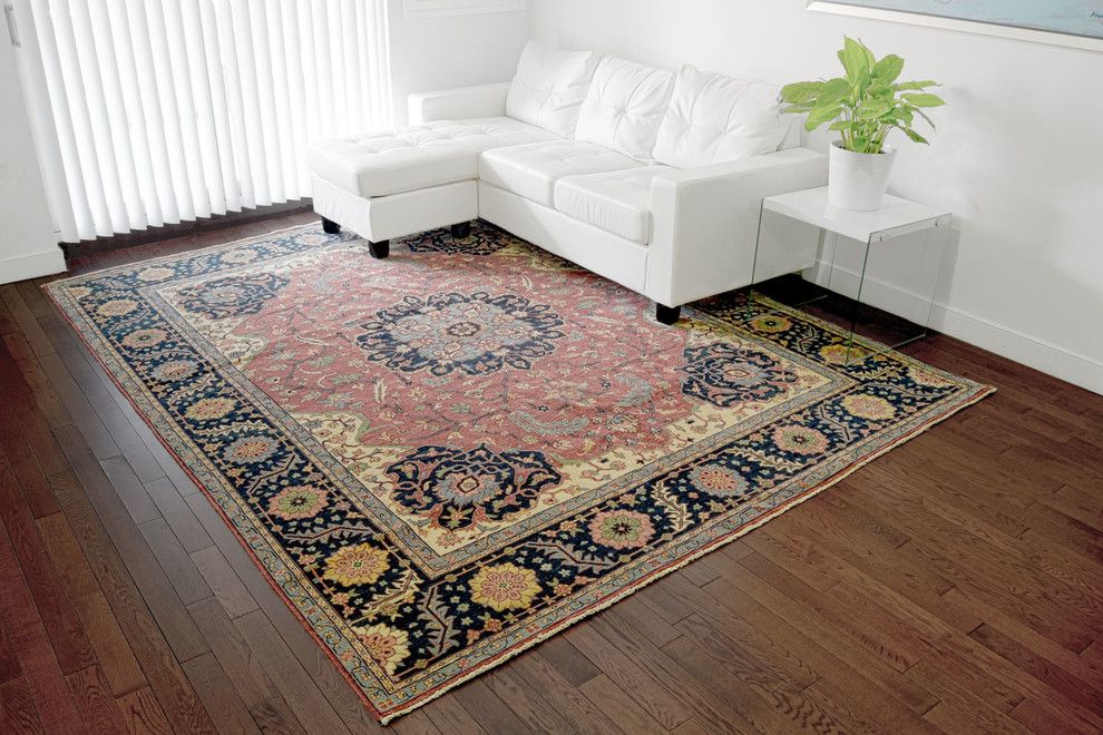 Laying Laminate Flooring for a Contemporary Living Room with a Traditional Area Rug and Collections by 1800 Get a Rug