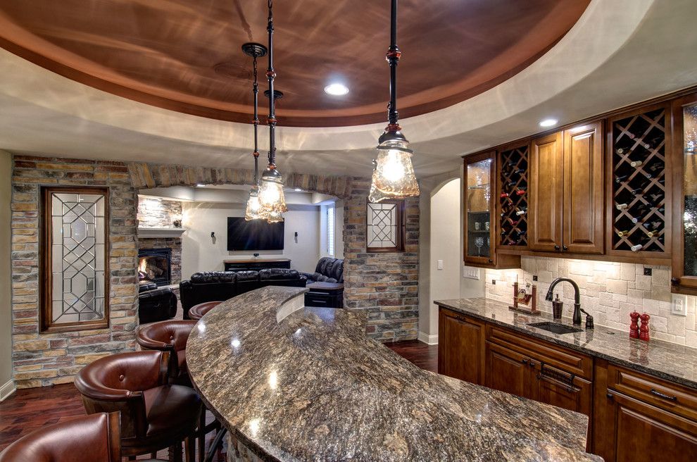 Leland Furniture for a Traditional Wine Cellar with a Architectural Details and Basement Wet Bar Countertop by Finished Basement Company