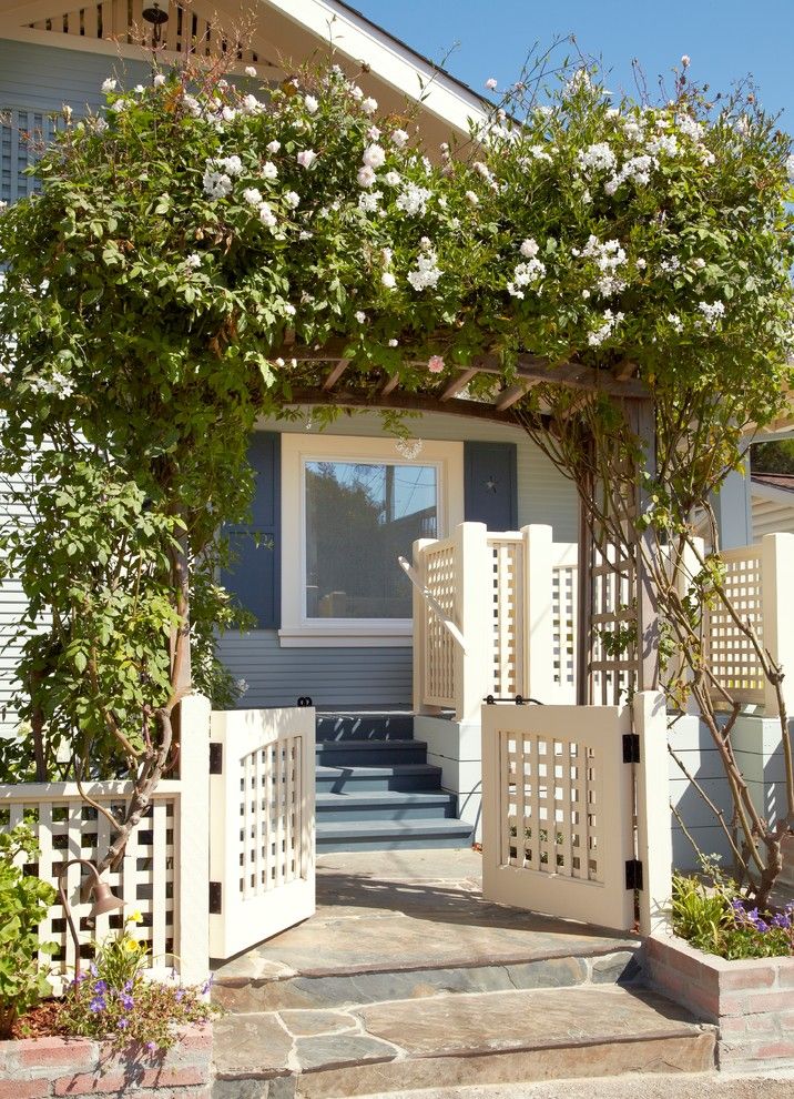 Lencioni for a Beach Style Landscape with a Front Porch and Beach Cottage Renovation for Aging in Place by Nancy Van Natta Associates